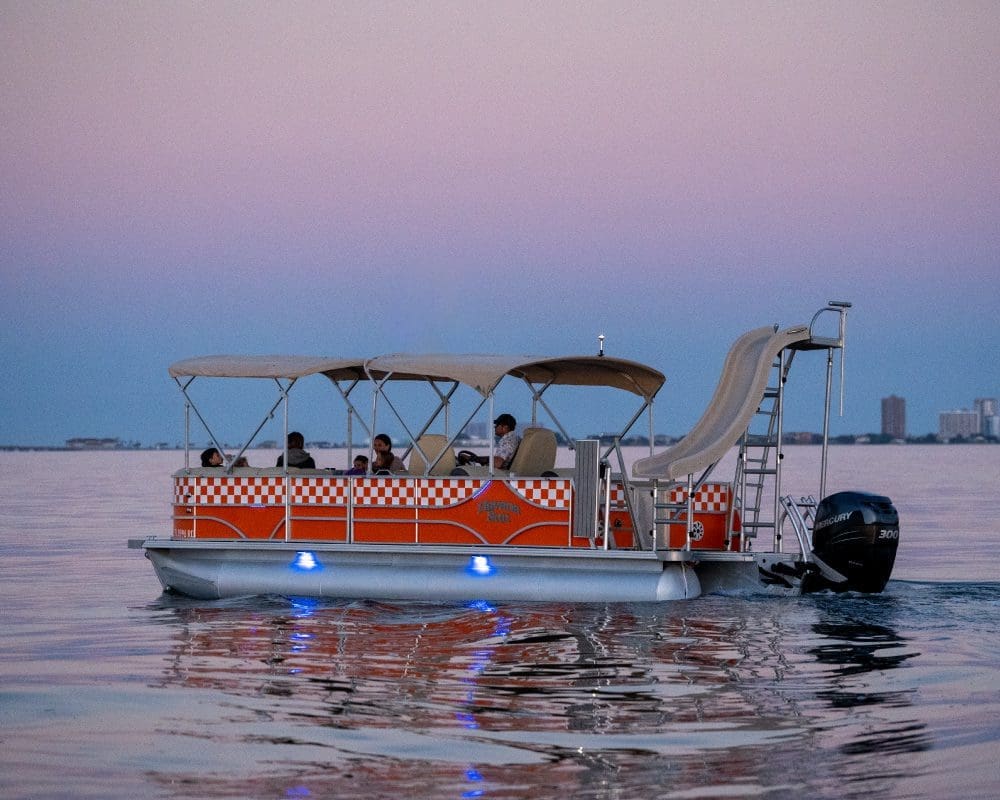 Captained pontoon boat with family slide.