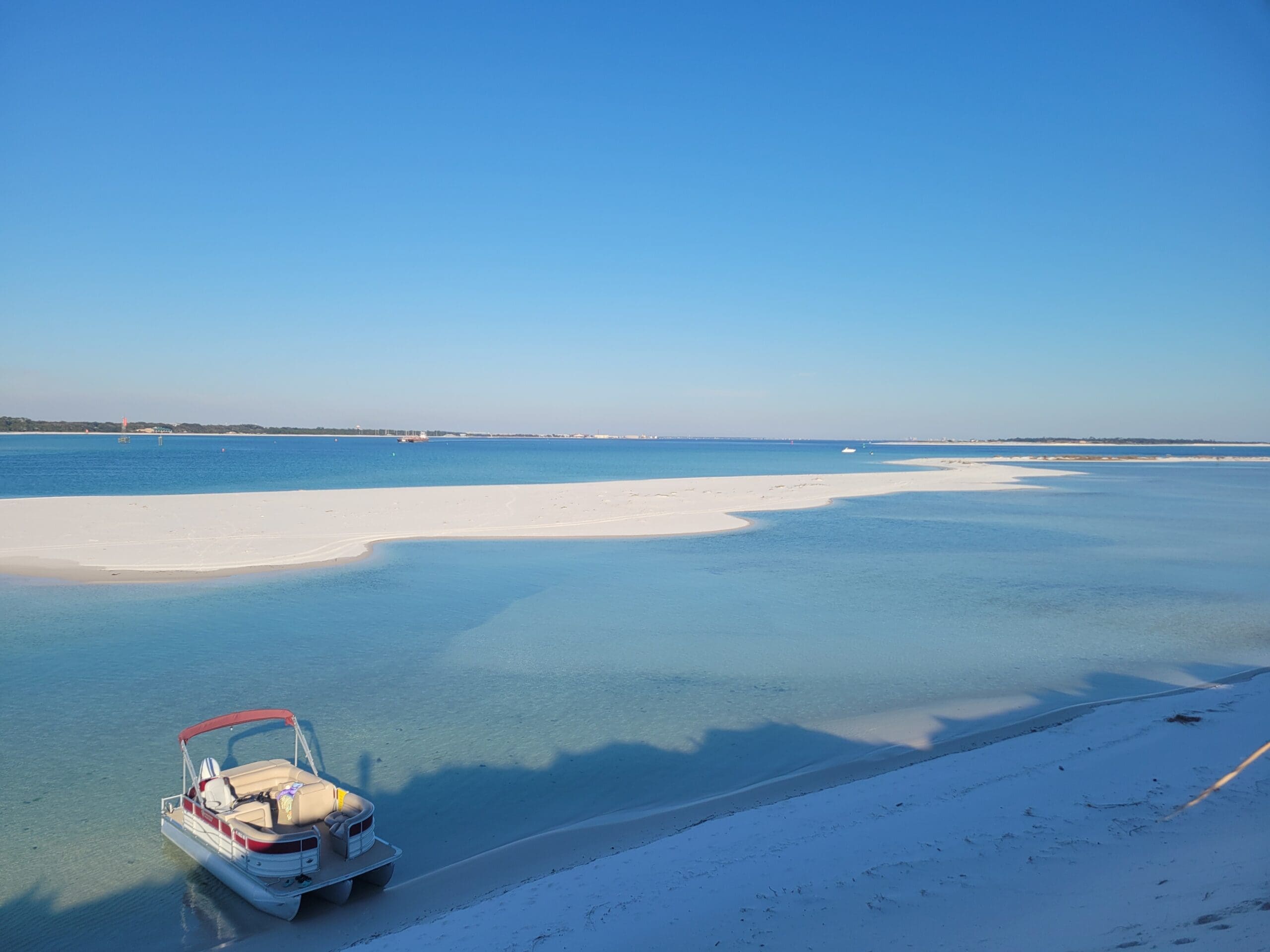 Luxury boat rentals Pensacola Beach anchored at Sand Island near Fort McRee.